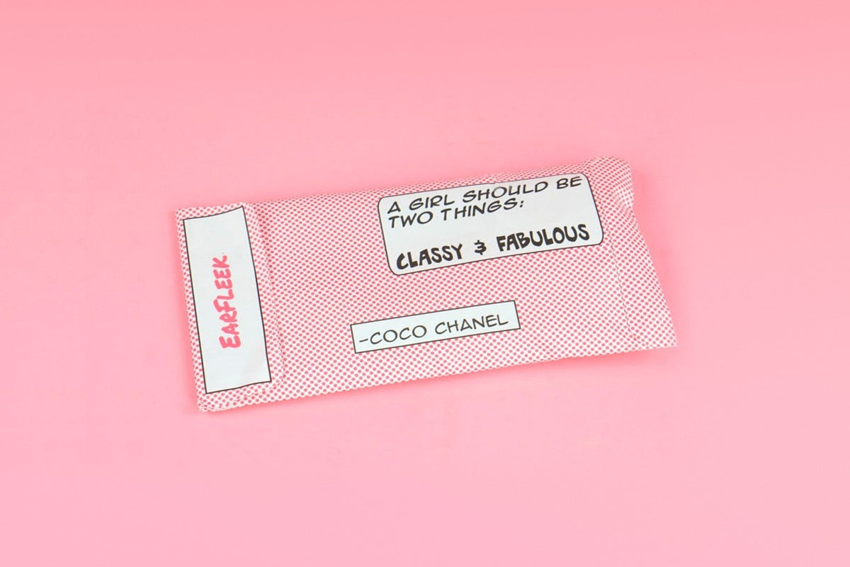 EarFleek's pink polka-dot mailer envelope with the EarFleek logo and a Coco Chanel quote, on a pink background