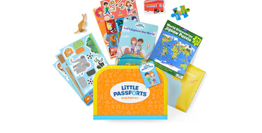 A Little Passports Early Explorers welcome kit: an orange suitcase printed with the Little Passports logo, surrounded by sticker sheets, a Let’s Explore the World booklet, a 24-piece world map puzzle, and pop-out animals.