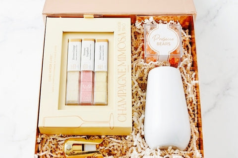 Cheers, Darling- a Shimmering mimosa brunch box featuring shimmering mimosa cubes by Teaspressa and prosecco gummy bears.