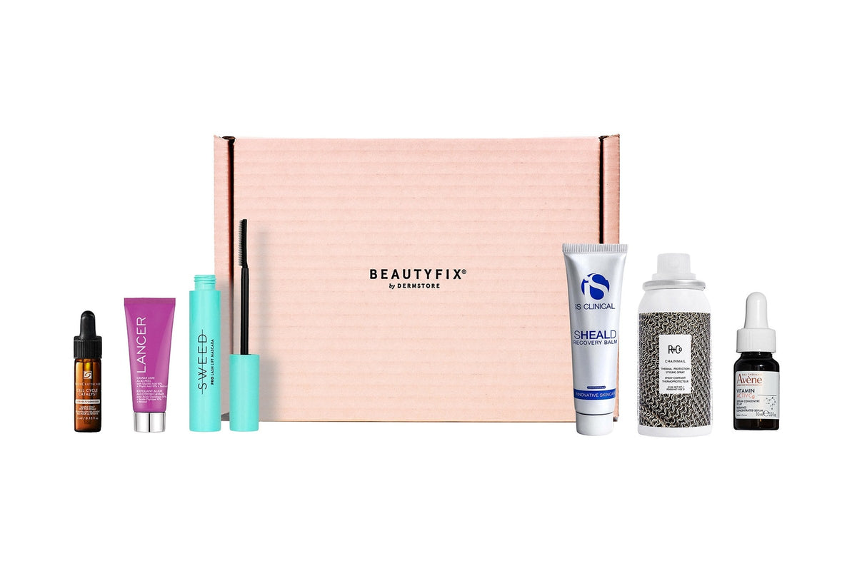 BeautyFIX by Dermstore pink subscription box with skincare, mascara, and hair products lined up on each side