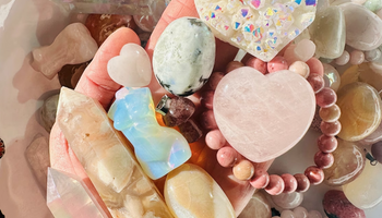 A crystal mystery box with tumbled stones and crystal specimens