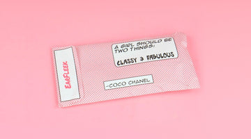 EarFleek's pink polka-dot mailer envelope with the EarFleek logo and a Coco Chanel quote, on a pink background