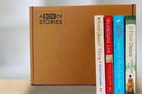 Brown box filled with a diverse collection of books in multiple genres, including crime thrillers, romance, and fantasy