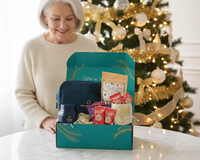 Elderly woman smiling while opening her Senior Joy December Box, a thoughtful subscription gift for seniors.