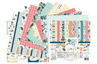 Colorful scrapbook papers and stickers in a monthly scrapbook kit featuring floral designs and cameras, ideal gifts for women