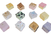Top‑down grid of 12 artisan marshmallows with colorful toppings. Assorted gourmet marshmallow squares in seasonal flavors