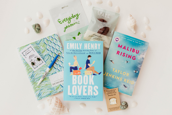 2 Book Box with Novelty items ranging from stationery to jewelry and skincare. Plus a sweet treat to enjoy.