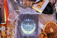 A full moon Busy Witch Box offering. A journal, ritual candles, a hand created & crafted herbal bundle of rosemary, juniper & cinnamon + 