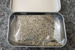 Inside of tin. Contains 1/3oz of our all natural, organic catnip, sealed, and always fresh. Maintains freshness until needed.