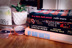 Brown subscription box filled with four young adult light reading books, featuring engaging stories and relatable characters for teen reader