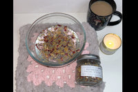 A bowl of hot water with some of the facial steam jar inside. A cup of tea to enjoy with the experience.