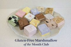 Assorted gourmet marshmallow squares in seasonal flavors made with real marshmallow root, on a white plate.