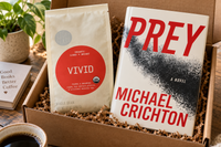 Michael Crichton's Prey hardcover novel paired with Vivid coffee blend in a monthly sci-fi book subscription box