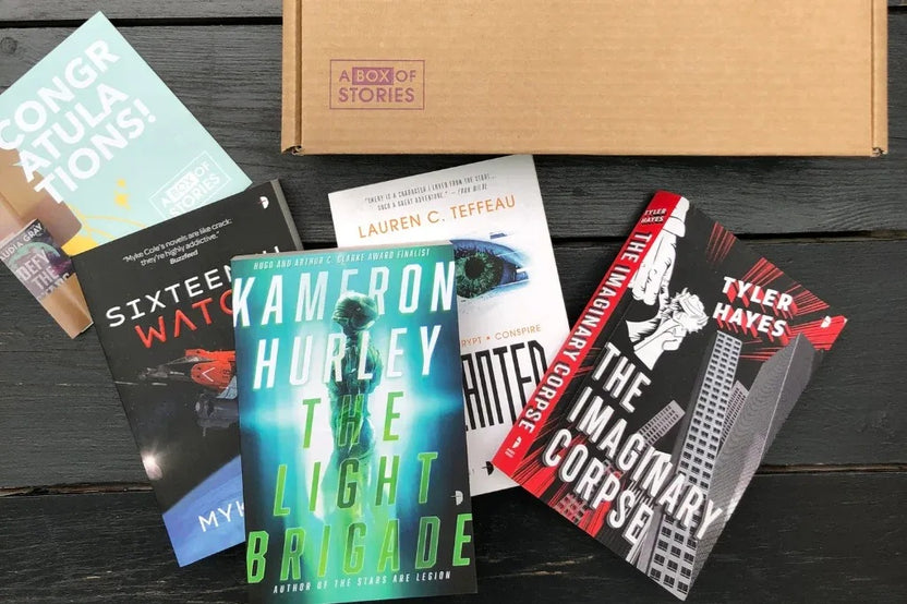 Brown gift box containing four books in genres chosen by the customer, perfect for book lovers.