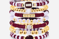 Game Day 8-piece stackable friendship bracelet set in maroon, white, and gold CZ beads with football, helmet, and GAME DAY letter charms, sh