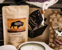 Introverts Retreat box showing coffee, maple brittle and bath salt soaks next to the actual box in the back.