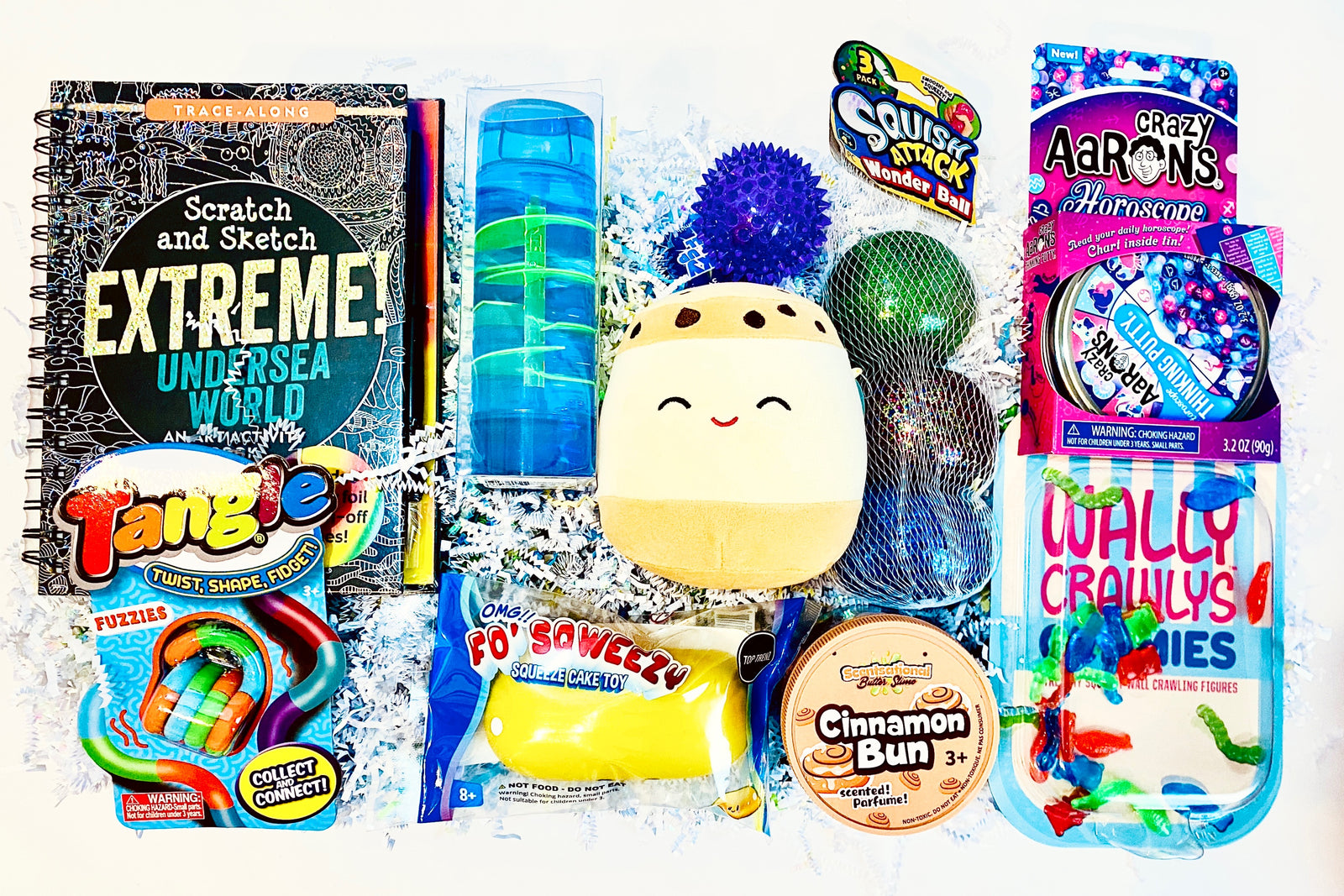 Scratch & Sketch, spiral timer, spiky LED ball, Thinking putty, Tangle, Twinkie squish, scented putty, Wally Crawlys, Plush, glitter balls