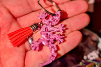 These are the free articulated lizard keychains included in every box and they come in a variety of colors.