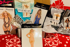 A Surprise Honey subscription box filled with a variety of lingerie.
