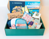 Two book box with added items for skincare and fashion. Name brand items such as Make Up Eraser and Sock it to me.