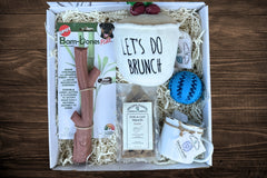 Box includes:
One full size bag dog treats,
One Chew Toy
One Plush/Rope/Ball
One themed gift for the human 
