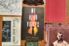This is a picture of a book titled We Hear Voices with partial views of a coloring page, newsletter, red envelope, lace fan