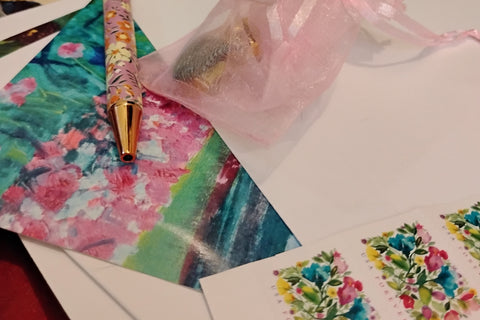 Complete stationery set with cards, pen, and stamps
