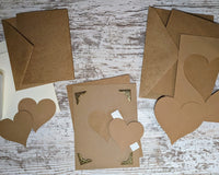 Small & large greeting cards with matching envelopes & cardstock heart cutouts along with rectangular cardstock cutouts & decorative corners