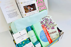 Colorful TEEN WISHBOX subscription box filled with skincare, socks, and snacks, ideal as a holiday gift for teens