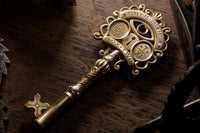 Very high quality close up photo of a detailed old key that is part of a mystery and escape game box.