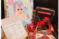 Deadpool care pack includes Deadpool cologne, cushy Avengers socks, Unicorn reading and a prescription for Self Care