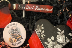 This deliciously dark book box includes a mix of dark romance smut & Halloween erotic horror books + a themed merch by Gothika Books.