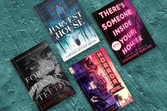 Four book titles from different authors laying on a blue desk or a table with absolutely no background.