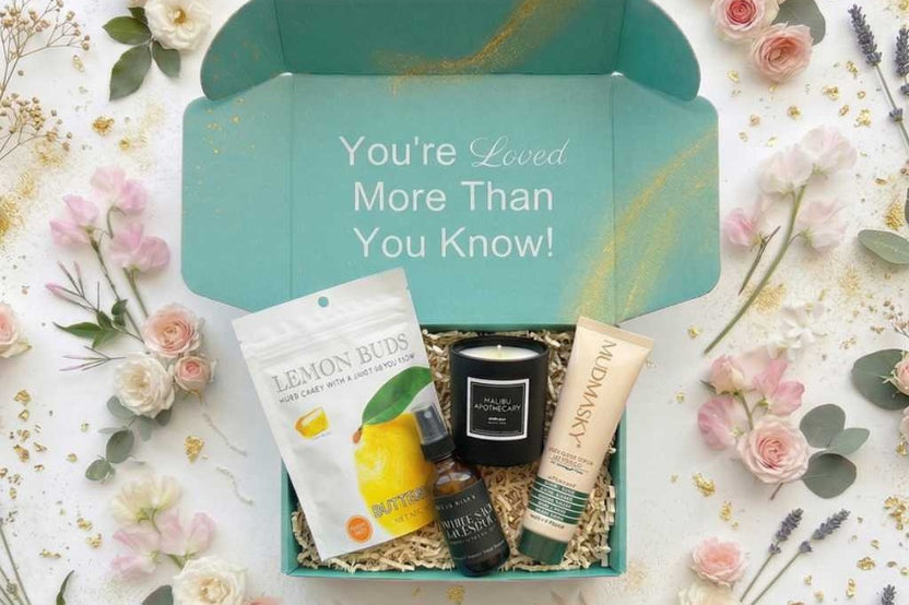 Open Senior Joy Box subscription box featuring snacks, a candle, and socks for aging parents on a cozy table setting