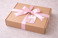 Kraft gift box tied with a bow and a gift tag, featuring awesome bookmarks and stationery themed each month.