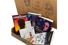 Brown box filled with crime thriller books, showcasing a variety of gripping titles and intriguing covers, perfect for mystery lovers