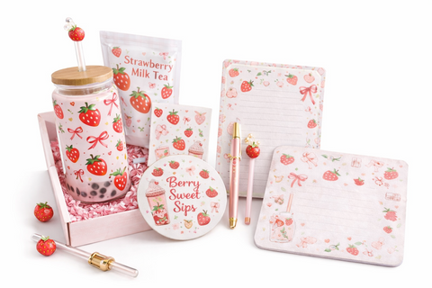 Strawberry themed bubble tea subscription box featuring a collectible boba cup with bamboo lid, instant strawberry milk tea, reusable straw