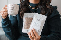 A hand pours tea from a kettle into a cup beside a Tea Runners subscription box and loose leaf tea packages
