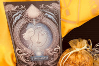 An altar card designed from the Strength card in Tarot. A female figure is aligned with the mane of the lion 