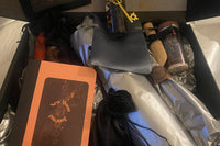 Pictured is a magickal New Moon Box with bath ritual blend, anointing oils, ritual candles, a New Moon journal and more!