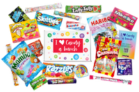 Colorful full print box with I heart sticker on top surrounded by all the sweet candy treats that would be included in the gift.  