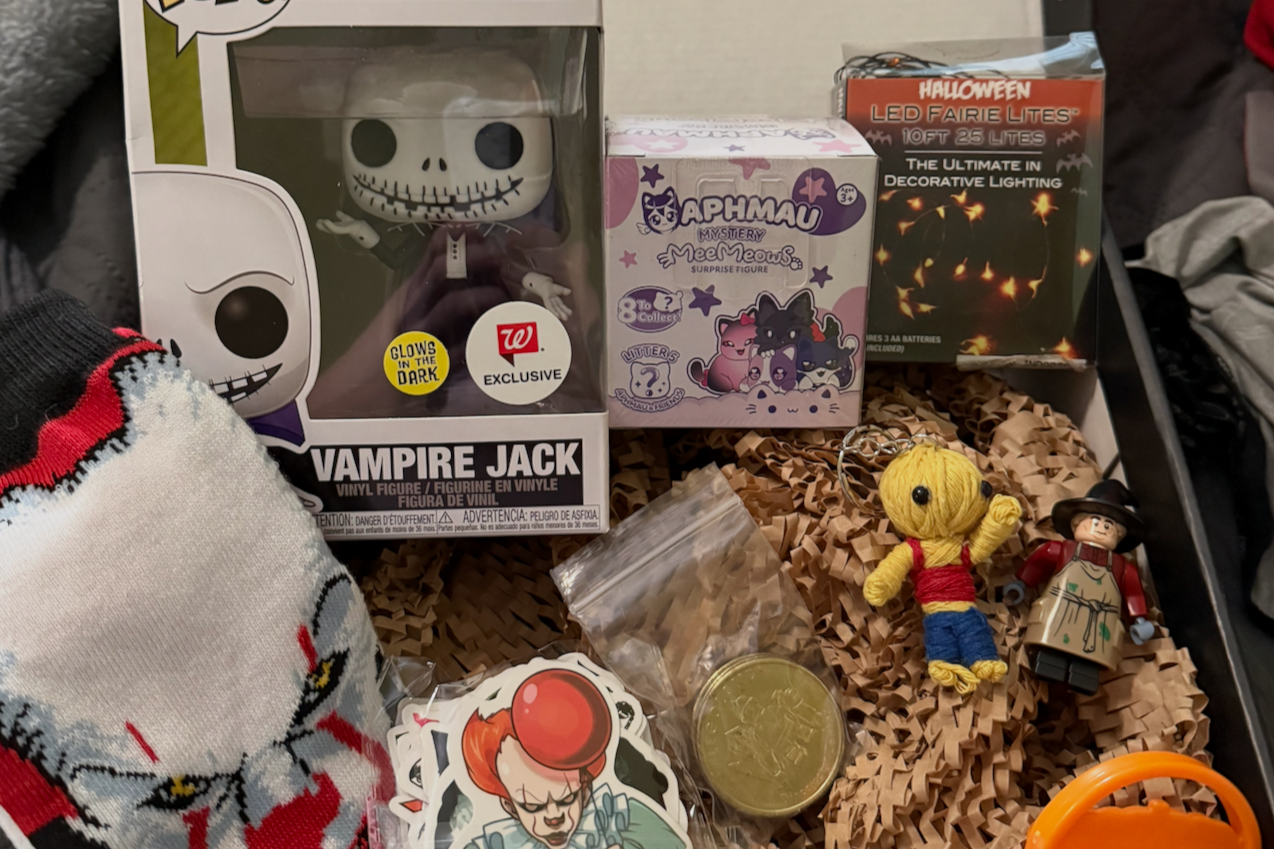 Halloween theme box has spooky and cute items including Nightmare before Christmas Funko, Halloween Fairy Lights It Socks and stickers