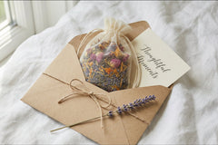 Wellness gift set with herbal bath sachet and affirmation card in eco friendly kraft paper packaging