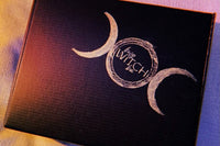 Black Busy Witch Box featuring crescent moon designs, ideal for a Witchcraft subscription box focused on Sabbat rituals