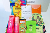 Colorful TEEN WISHBOX subscription box filled with skincare, socks, and snacks, ideal as a holiday gift for teens