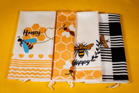 Bee themed kitchen towels included in the Bee Kind Appreciation Box, adding a bright and cheerful touch to this thoughtful gift set.