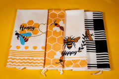 Bee themed kitchen towels included in the Bee Kind Appreciation Box, adding a bright and cheerful touch to this thoughtful gift set.