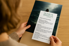 Hands holding an 8x10 print of Jesus walking on water during a storm, alongside a June Olive Branch Art Series devotional card