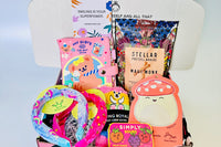 Colorful items in the TWEEN WISHBOX subscription box include gel pens, a notebook, and fun accessories for tween girls