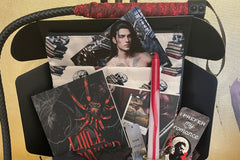 This deliciously dark book box includes a mix of dark romance & Halloween erotic horror books + a themed merch by Gothika Books.